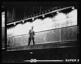 12.-Unidentified-man-standing-in-front-of-a-Trade-board-on-which-he-records-a-Market-Score-at-the-Merchandise-Mart