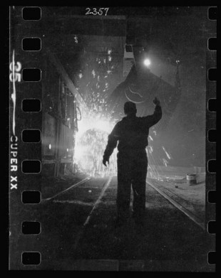 15.-Steel-worker-in-mill-as-molten-steel-spills-from-vat-in-Chicago-Illinois-2